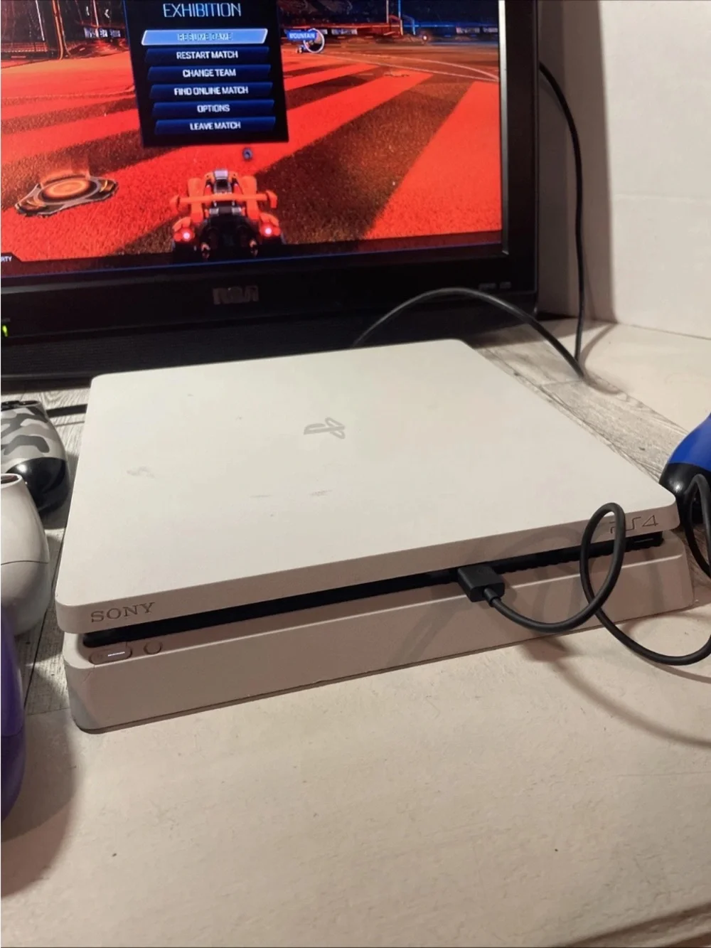Sony White PS4 Slim with White, Purple and Camo Controllers